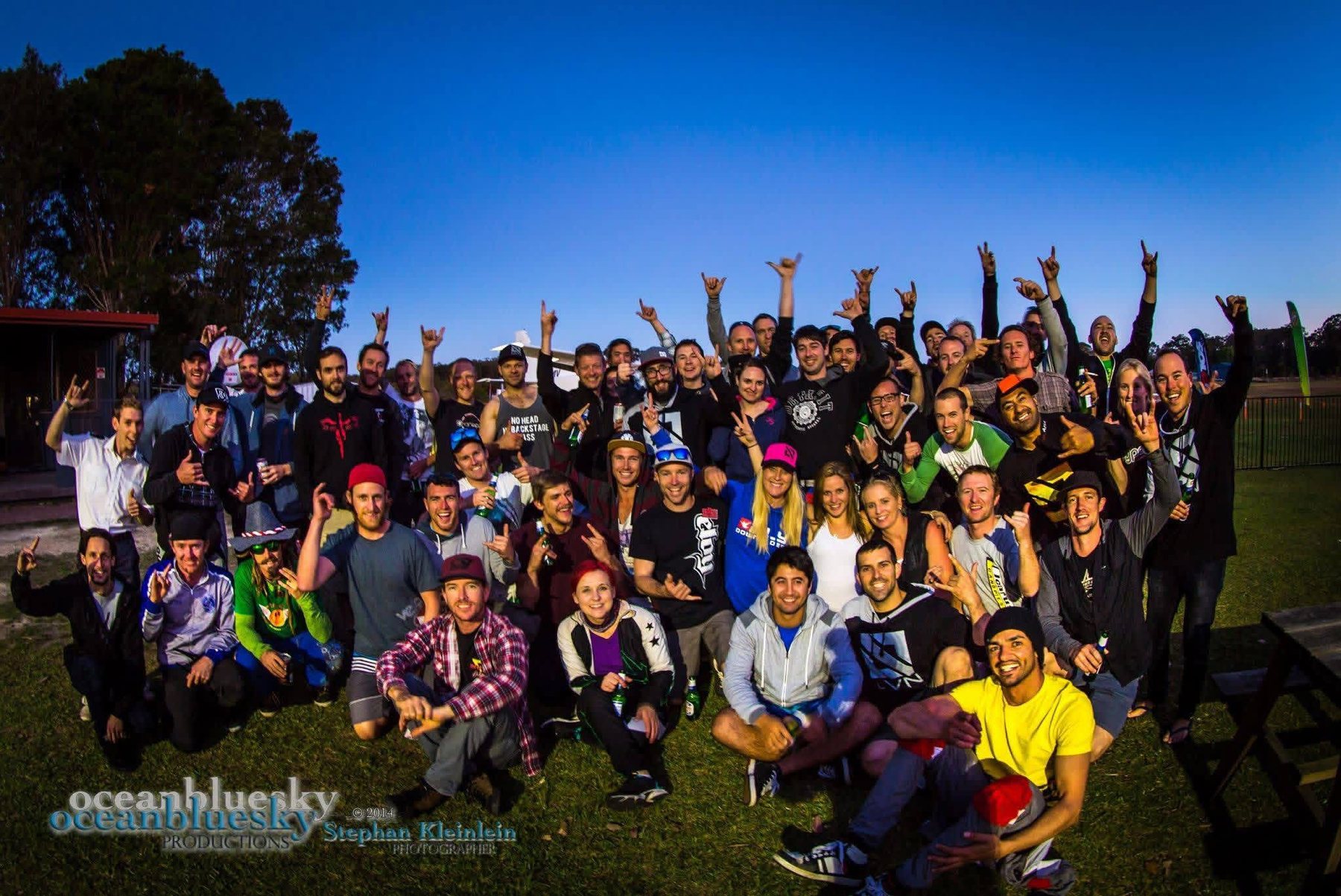 A big camp group photo on the drop zone at sunset