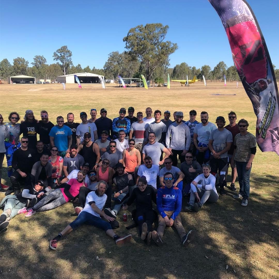 A big group on the grass at a skydiving camp