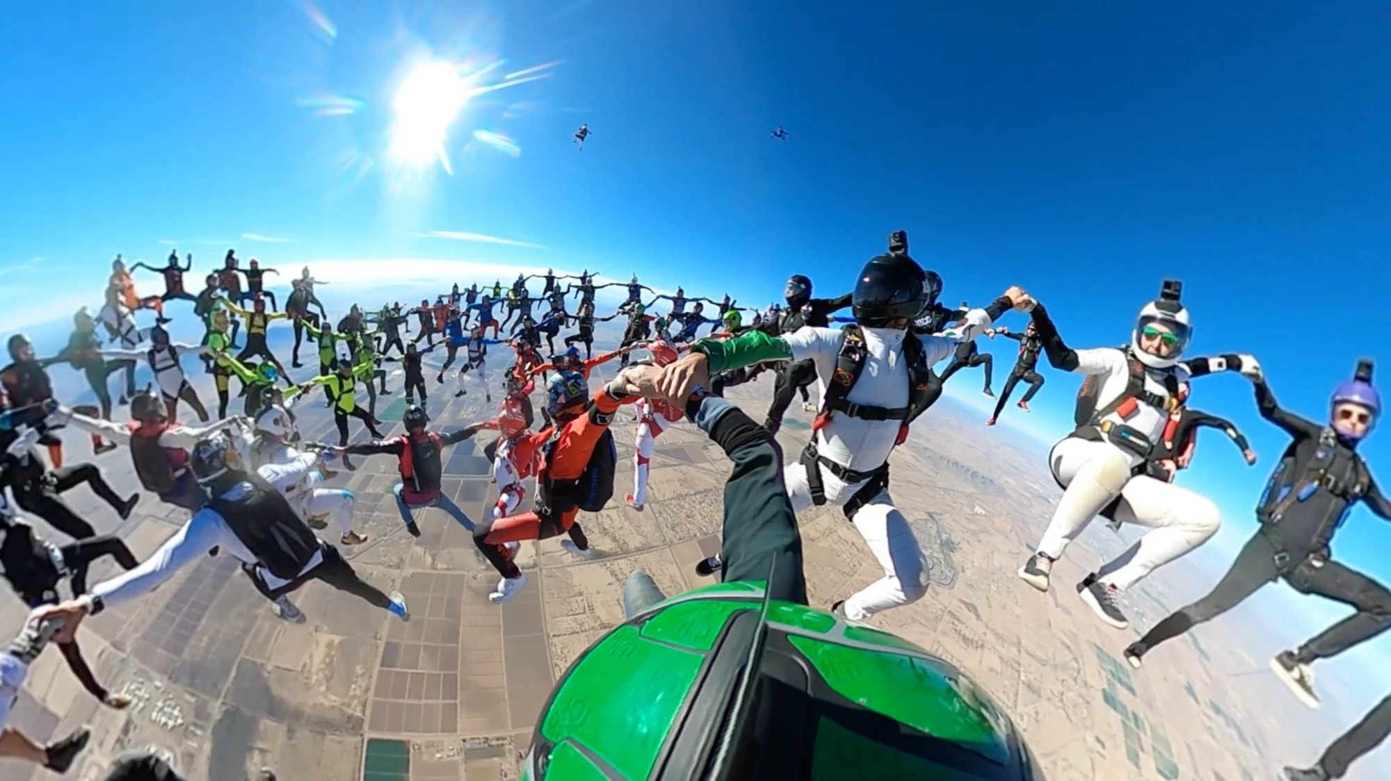 The 96-way head-up world record over Skydive Arizona, seen from Mason's green helmet