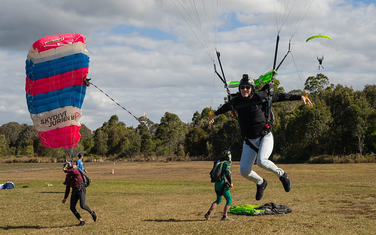 A jumper landing under canopy at the drop zone