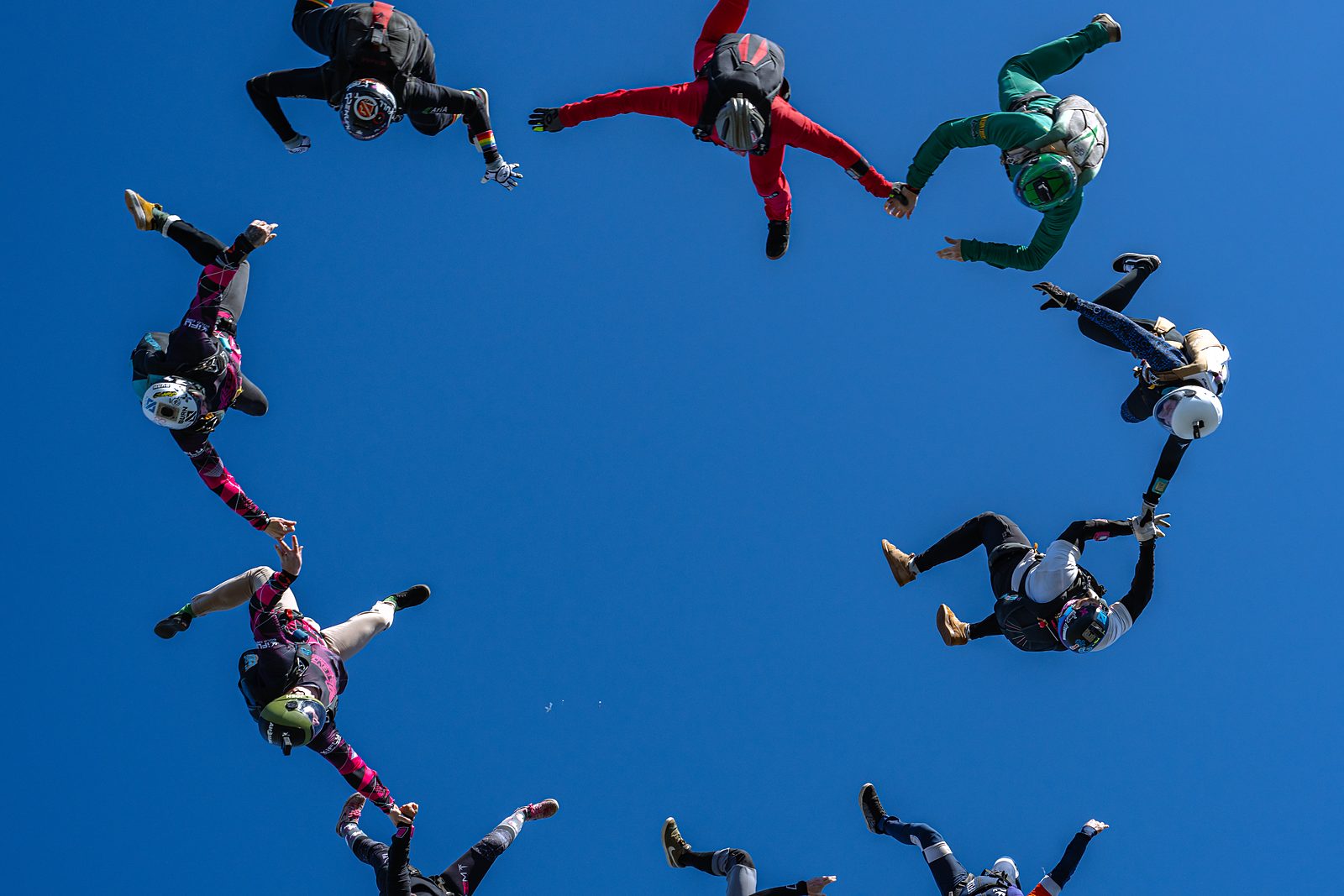 A large round freefall formation against blue sky